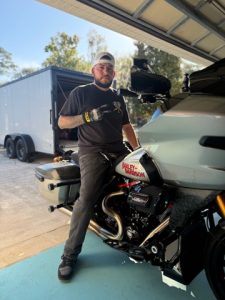 Steven - Co-Founder of Road Hog Garage with his Harley-Davidson Road Glide